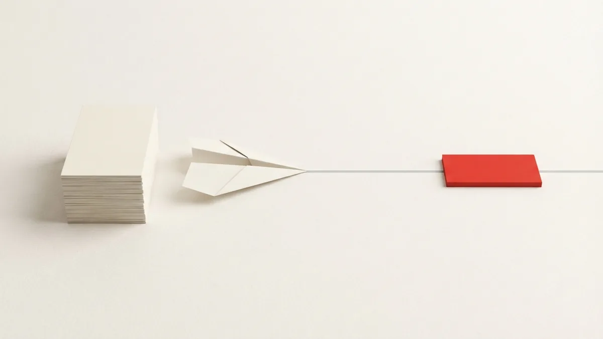 Stacked paper forms and a threshold block symbolizing VAT exemption steps
